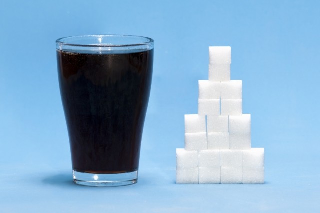 Sugary Beverage with Stack of Sugar Cubes