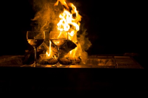 Wine Glass With Fire in Background